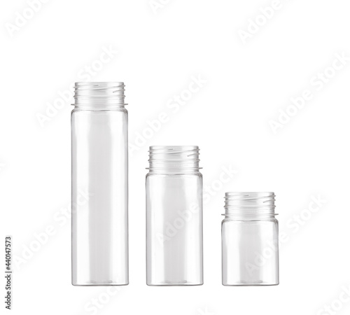 White cosmetic bottles  isolated on a white background. Identical rectangular bottles of different sizes.