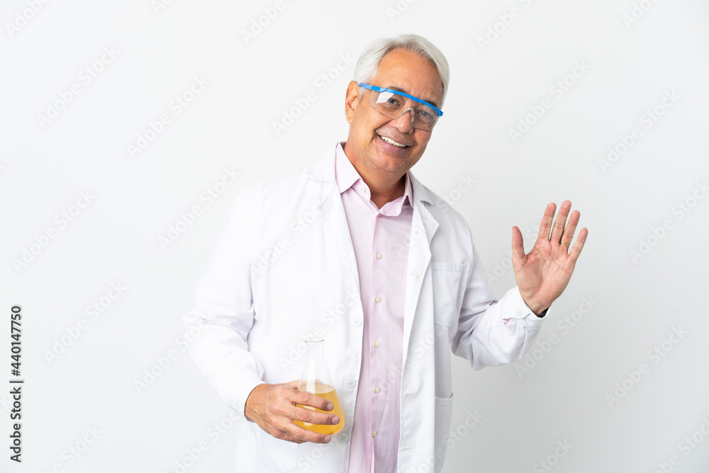 Middle age Brazilian scientific man scientific isolated on white background saluting with hand with happy expression Middle age Brazilian scientific man scientific isolated on white background saluting with hand with happy expression