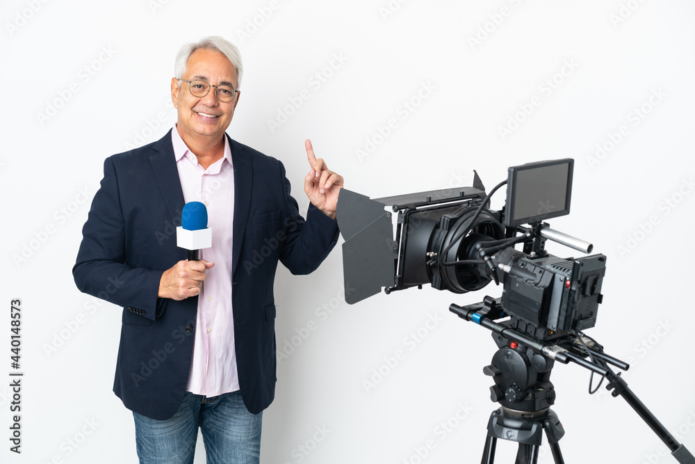Reporter Middle age Brazilian man holding a microphone and reporting news isolated on white background pointing up a great idea