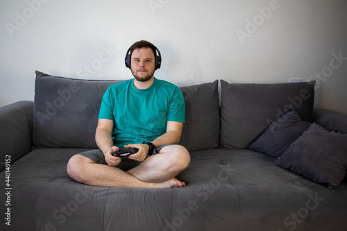 gamer playing video games with controller