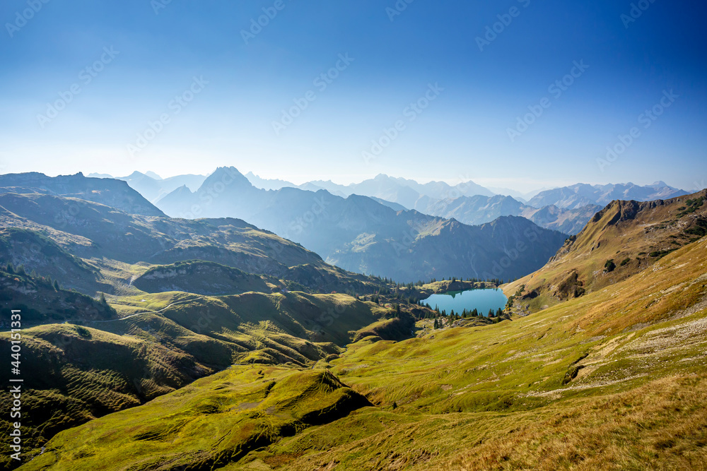 Scenic view of Allgau Alps with Seealpsee lake in background Scenic view of Allgau Alps with Seealpsee lake in background