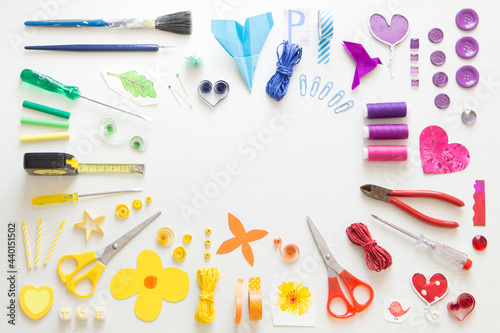 Colorful arrangement of various tools and sewing items photo