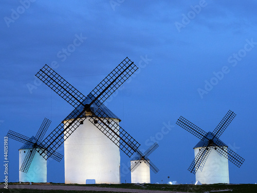Spain, Province of Toledo, Campo de Criptana, Historical windmills at dusk photo