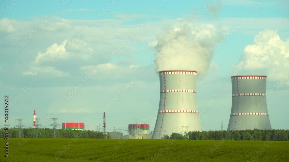 Nuclear power plant, Cooling tower of nuclear power plants. Industrial zone with steam emission into the air atmosphere. Republic of Belarus, a station on the border with Lithuania. Nuclear power plant, Cooling tower of nuclear power plants. Industrial zone with steam emission into the air atmosphere. Republic of Belarus, a station on the border with Lithuania.