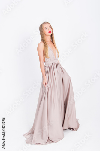 young girl in a wedding dress on a white background