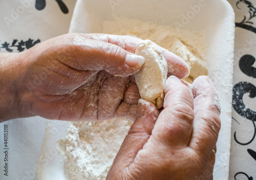Hands of senior person making croquettes