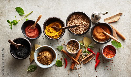 Studio shot of bowls with various Asian spices photo