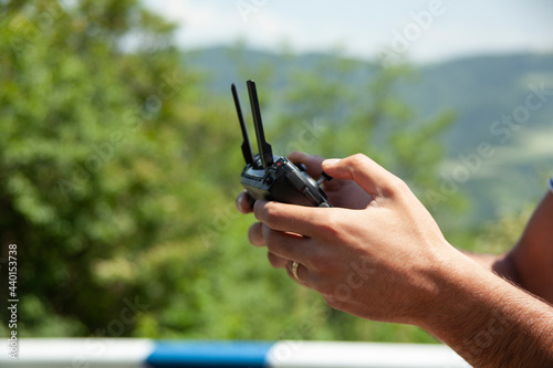 man holding drone remote control