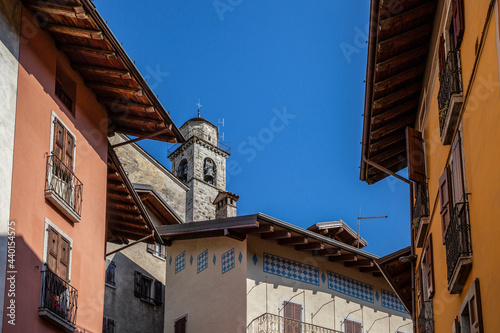 Bell tower of San Giorgio church near houses in Bagolino, Province of Brescia, Lombardy, Italy