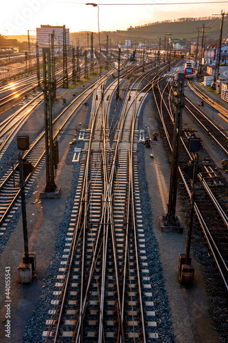 Germany, Bavaria, Wurzburg, Empty railroad tracks at sunset