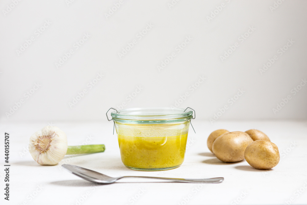Soup by vegetables and spoon on white background Soup by vegetables and spoon on white background