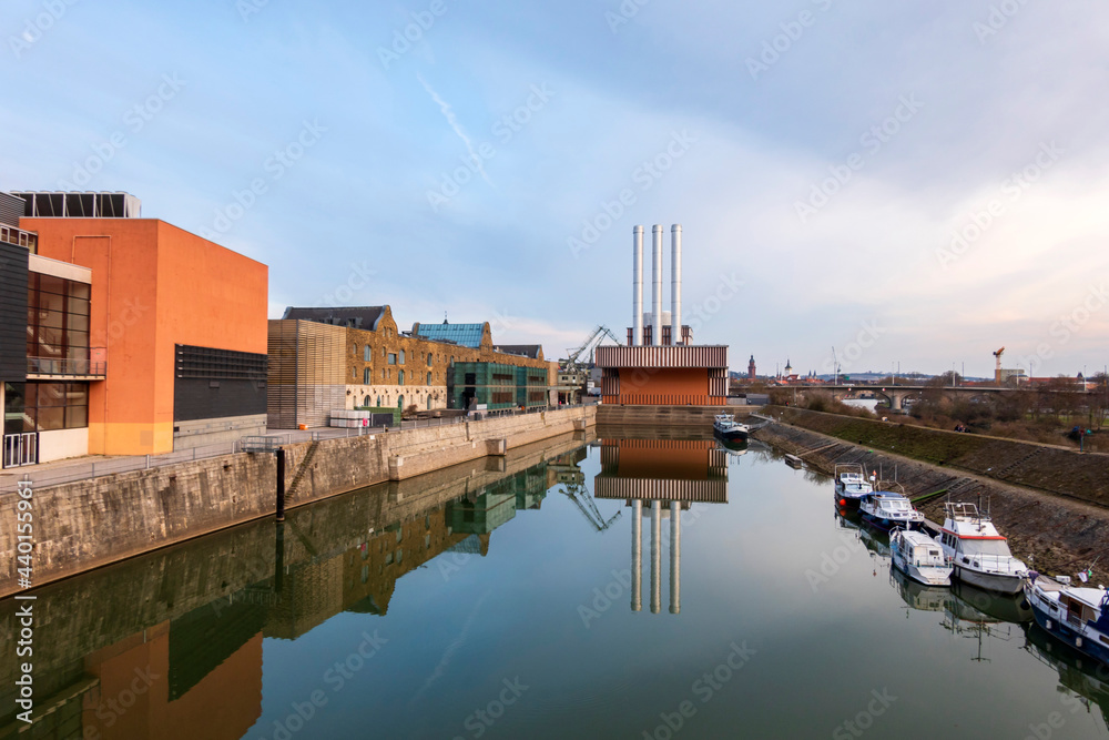 Germany, Bavaria, Wurzburg, Power station reflecting on shiny surface of city canal Germany, Bavaria, Wurzburg, Power station reflecting on shiny surface of city canal