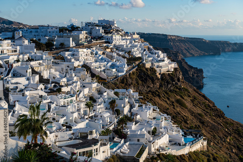 Greece, Santorini, Fira, White-washed houses of town situated at edge of coastal caldera photo