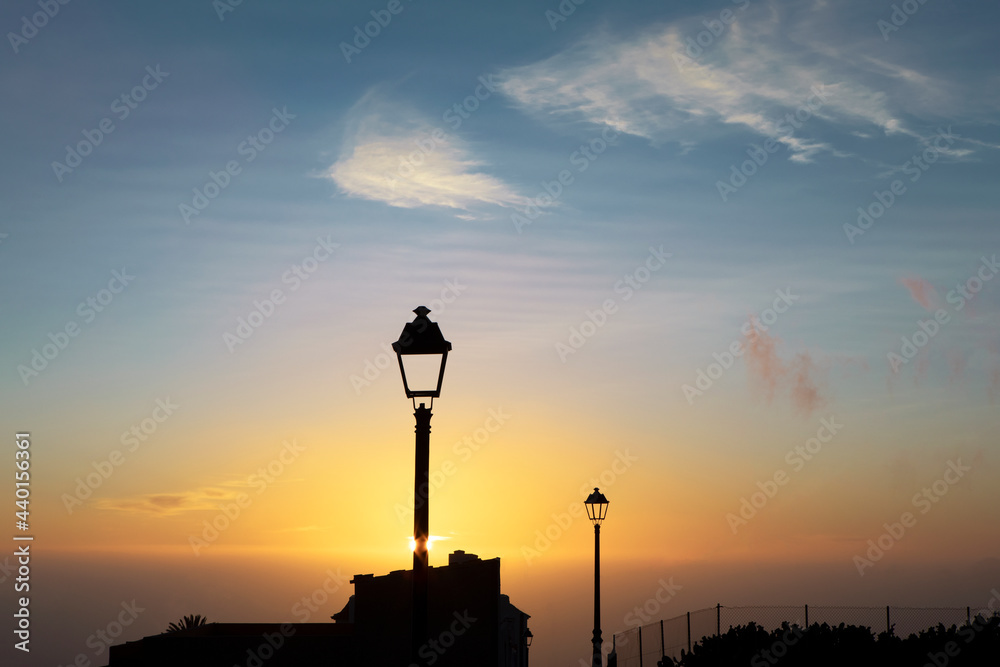 Street light in front of sky during sunset Street light in front of sky during sunset