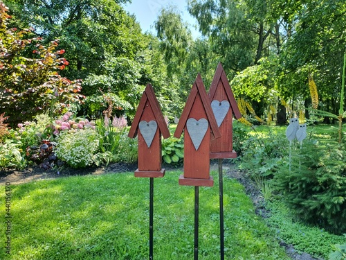 Wooden houses in the garden.  Red houses are installed in the garden as decorations.