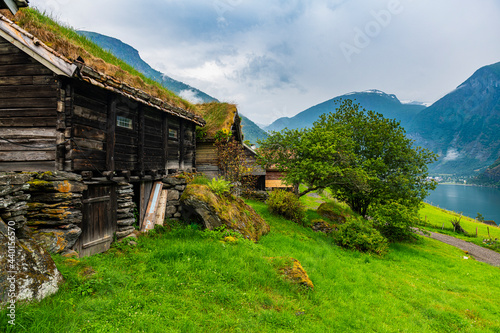 Norway, Aurland, Cottage of traditional village Otternes over Aurlandsfjord photo