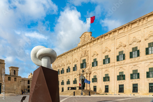 Malta, South Eastern Region, Valletta, Sculpture standing in front of Auberge de Castille photo