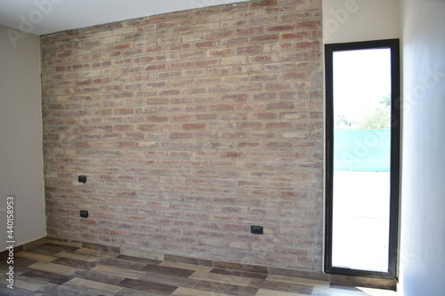 Brick Wall Room in Home Traditional Construction Building with Vertical Window and Wooden Style Floor Ceramic photo