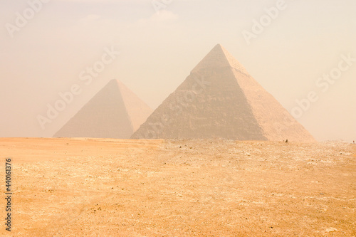 View of the Great Pyramids of Giza in Cairo Egypt on a hazing morning 