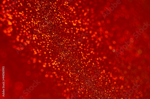 Abstract shiny blurred red background. Textured glittering backdrop for your projects. Copy space