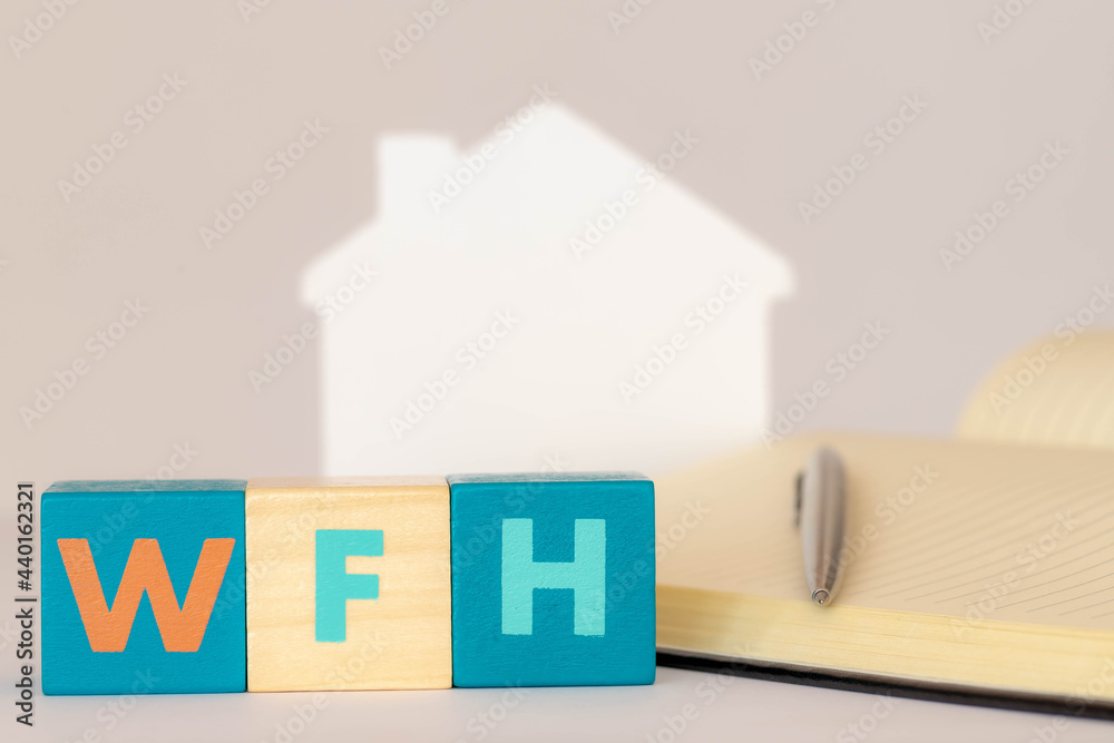 Work from home concept, Selective focus of colourful wooden blocks alphabet with abbreviations word WFH, Multicolour wood cube and notebook on white background, Free copyscape for your text. Work from home concept, Selective focus of colourful wooden blocks alphabet with abbreviations word WFH, Multicolour wood cube and notebook on white background, Free copyscape for your text.