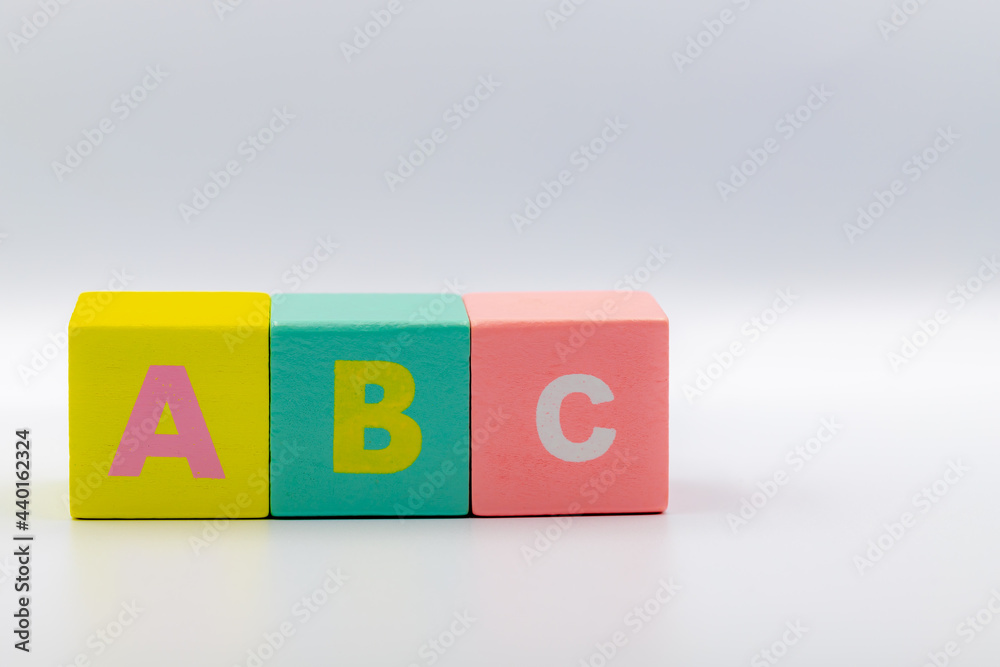 Education and learning concept, Colourful wooden alphabet ABC, Multicolour wood cube of uppercase letters on white colour background with free copyscape. Education and learning concept, Colourful wooden alphabet ABC, Multicolour wood cube of uppercase letters on white colour background with free copyscape.