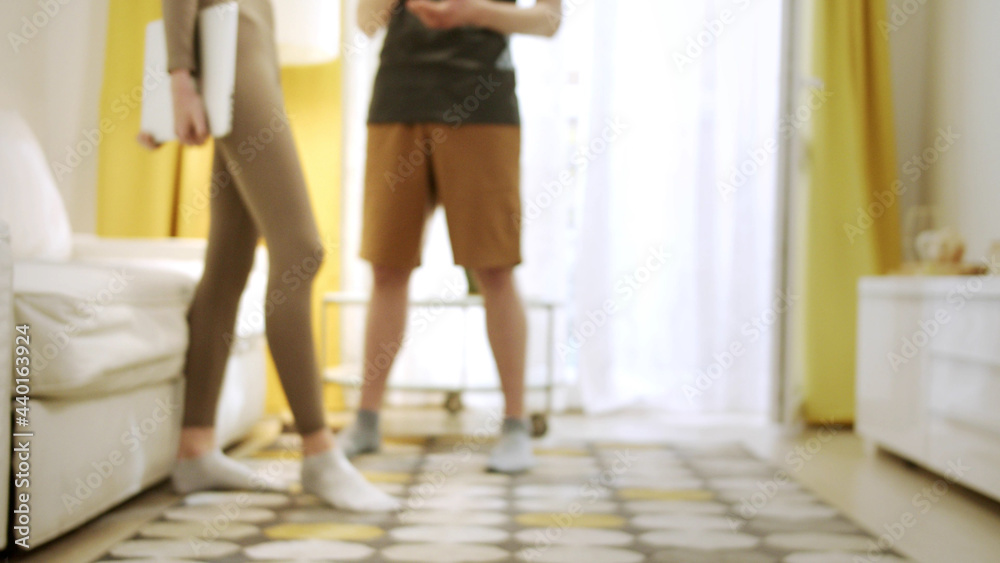 Two young people are standing and talking Two young people are standing and talking
