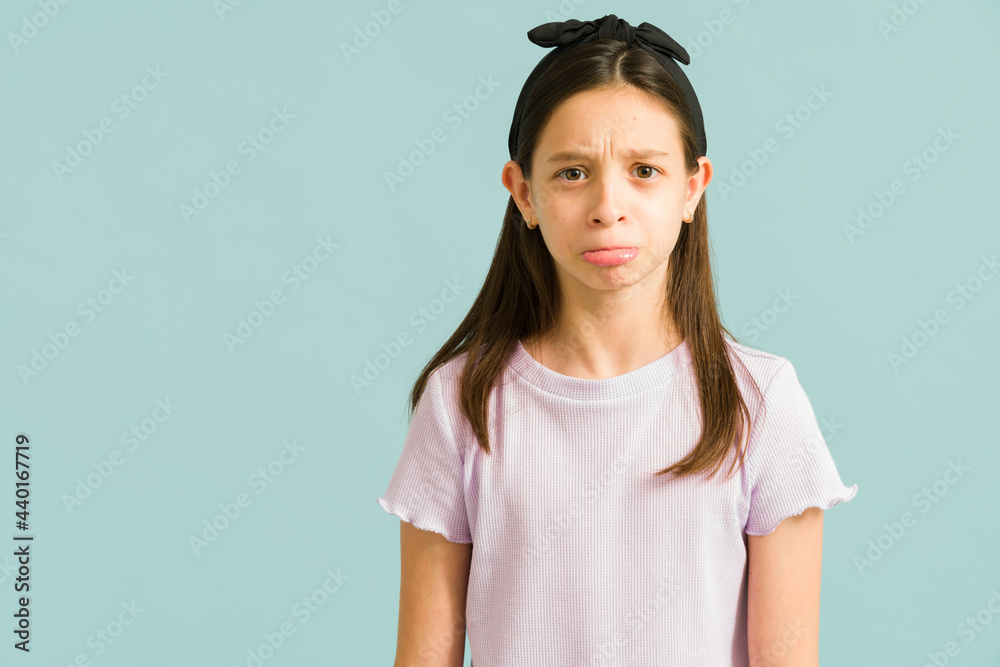 Adorable little girl frowning and wants a favor Adorable little girl frowning and wants a favor