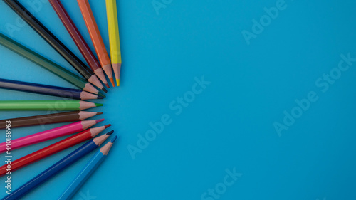 Fotografie Colored pencils on a blue background