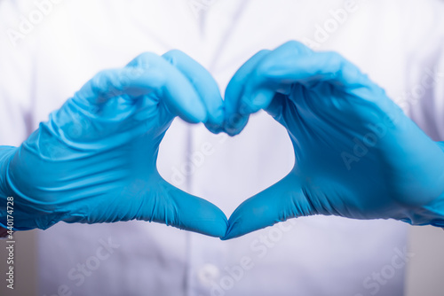 Close up of Doctor hands in gloves making shape of heart  Medicine and Healthcare Concept.