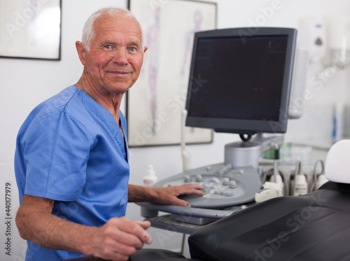 Portrait of elderly man hospital doctor in cabinet of ultrasound test