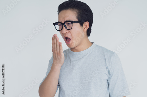 Cuadro en lienzo photo of Asian man with bad breath