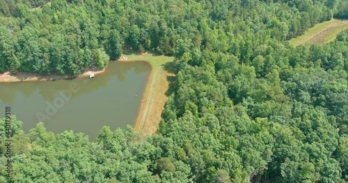 Panoramic aerial view of blue lake mountain between green summer forest in Campobello, South Carolina photo