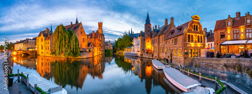Classic view of the historic city center of Bruges (Brugge) with Belfry bell tower in the background photo