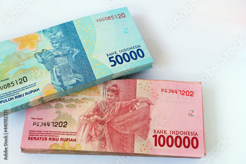 Indonesian rupiah banknote with a female dancer, 50,000 and 100,000. Focus selected