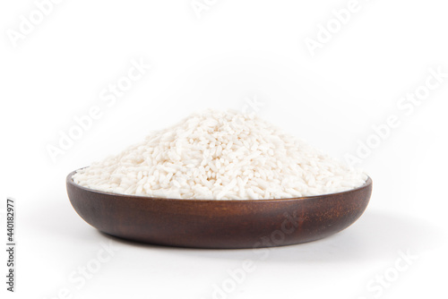 Raw organic white rice on white background, glutinous rice or sticky rice close up