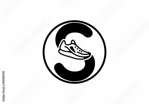 Black S initial letter with shoes in circle