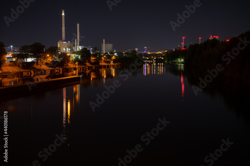 Reflection of the city lights on the canal captured on a clear nig photo