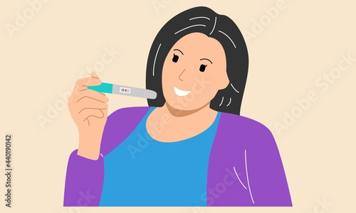 Woman holding pregnancy test pack with 2 red bar result positive
