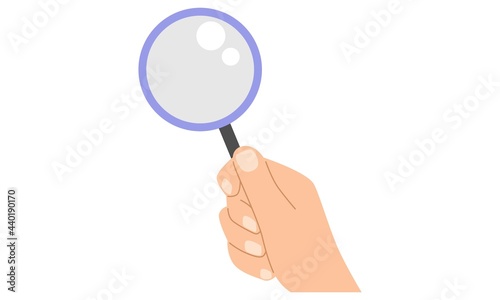 Hand hold a magnifying glass