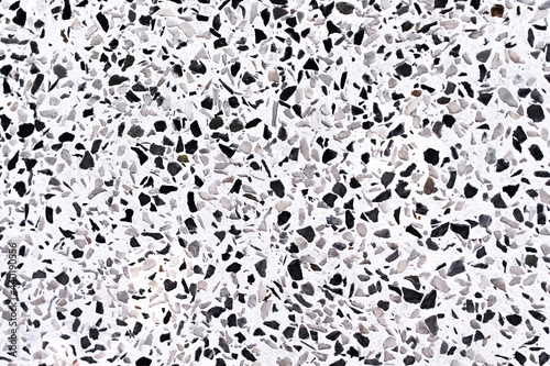 Terrazzo or multicolored polished stone floor , black brown on white background