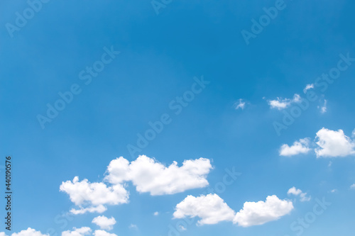 Clould with light wind on vast bright blue sky background with space
