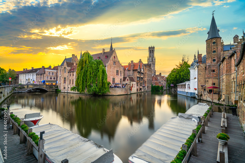 Rozenhoedkaai in the centre of Bruges illuminated at sunset, West Flanders province, Belgium