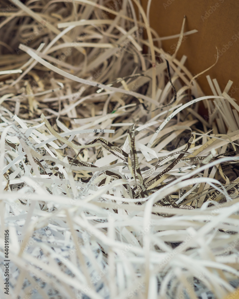 White shredded paper in a carboard box. White shredded paper in a carboard box.