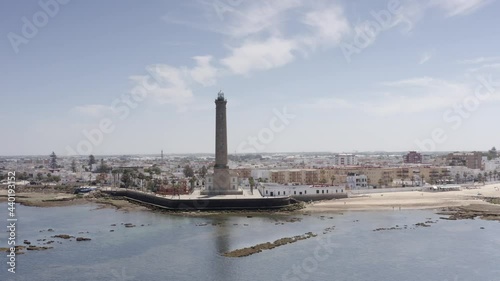 Aerial view over large Lighthouse in Chipiona, spain
Drone view from Chipiona spain, 2021
 photo