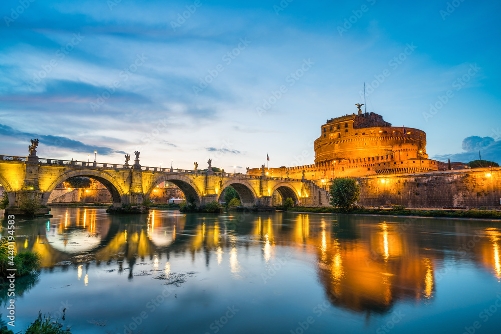 Saint Angelo castle an Tiber River at dusk in Rome, Italy