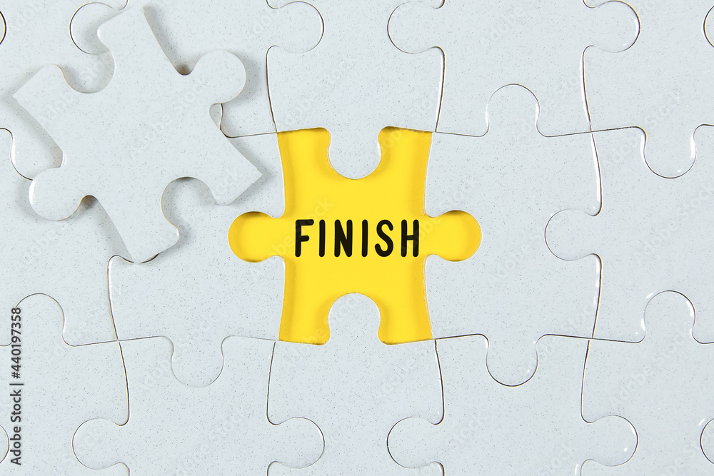 Fototapeta premium Finish Text on Puzzle Piece - business concept