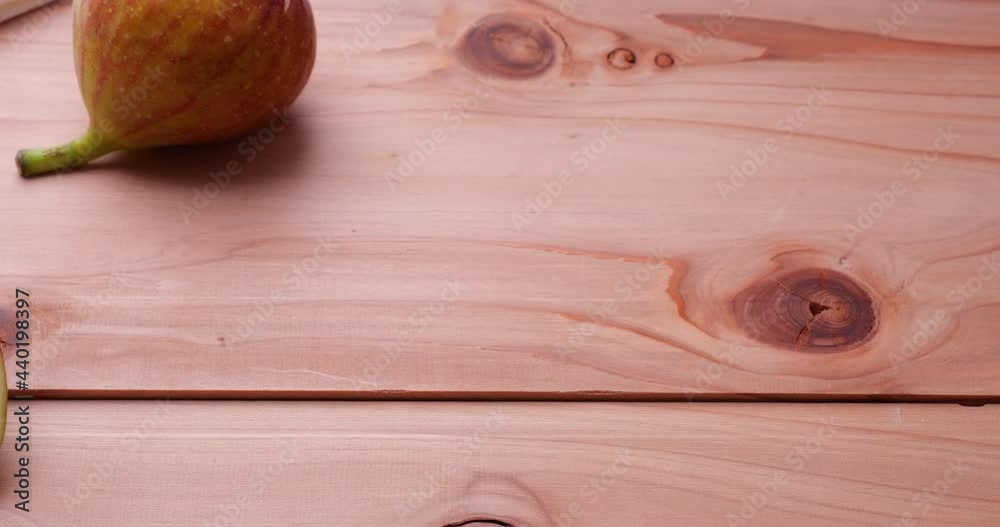 Dolly video with figs on a wooden board.
Dolly video with figs on a wooden board.