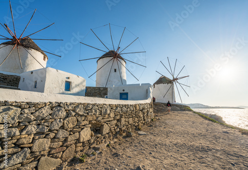 Mykonos island Windmills with sun flare. Greece 