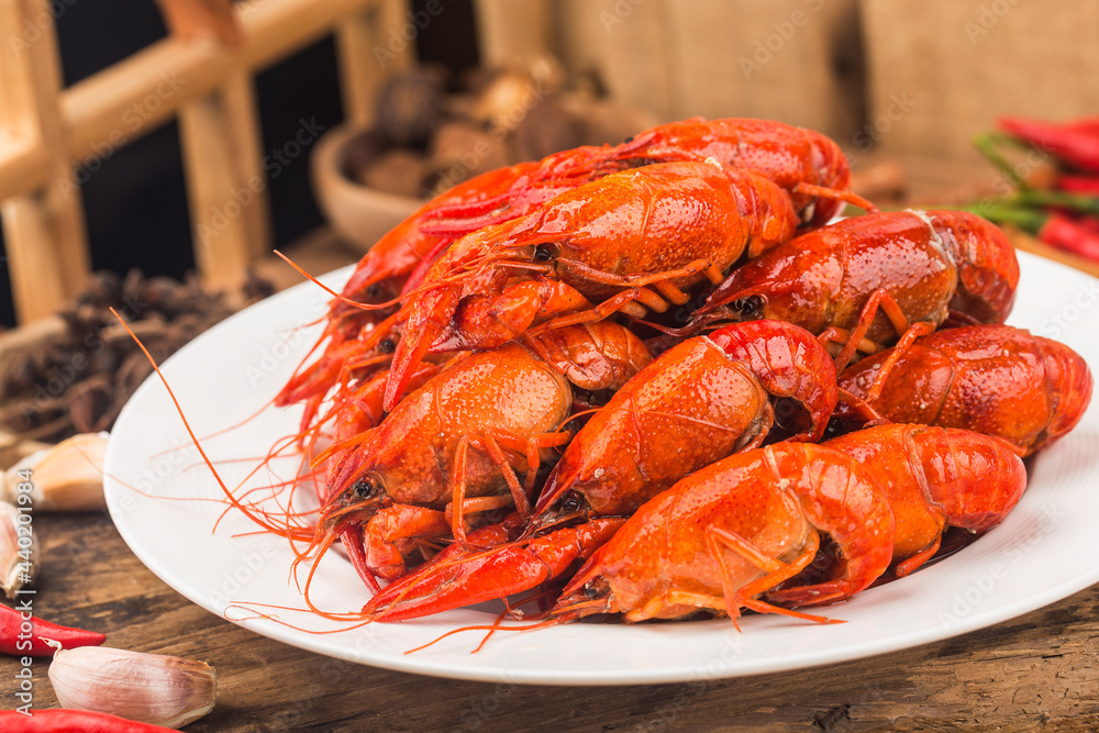 Crayfish. Red boiled crawfishes on table in rustic style, Lobster closeup. Crayfish. Red boiled crawfishes on table in rustic style, Lobster closeup.